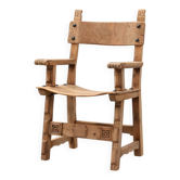 Brutalist armchair with carved rosettes and nailed wooden seat, Spain