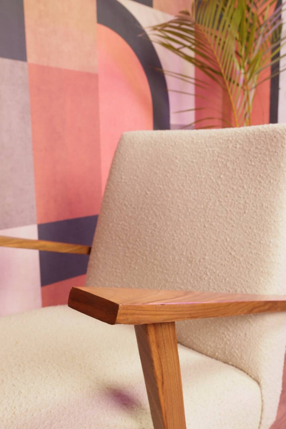 Vintage beige bouclé armchair with walnut wood from the 1950s.