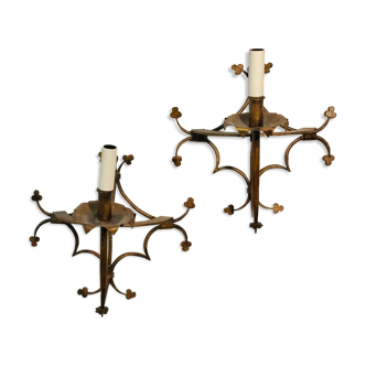 Pair of gilded metal sconces decorated with clovers.