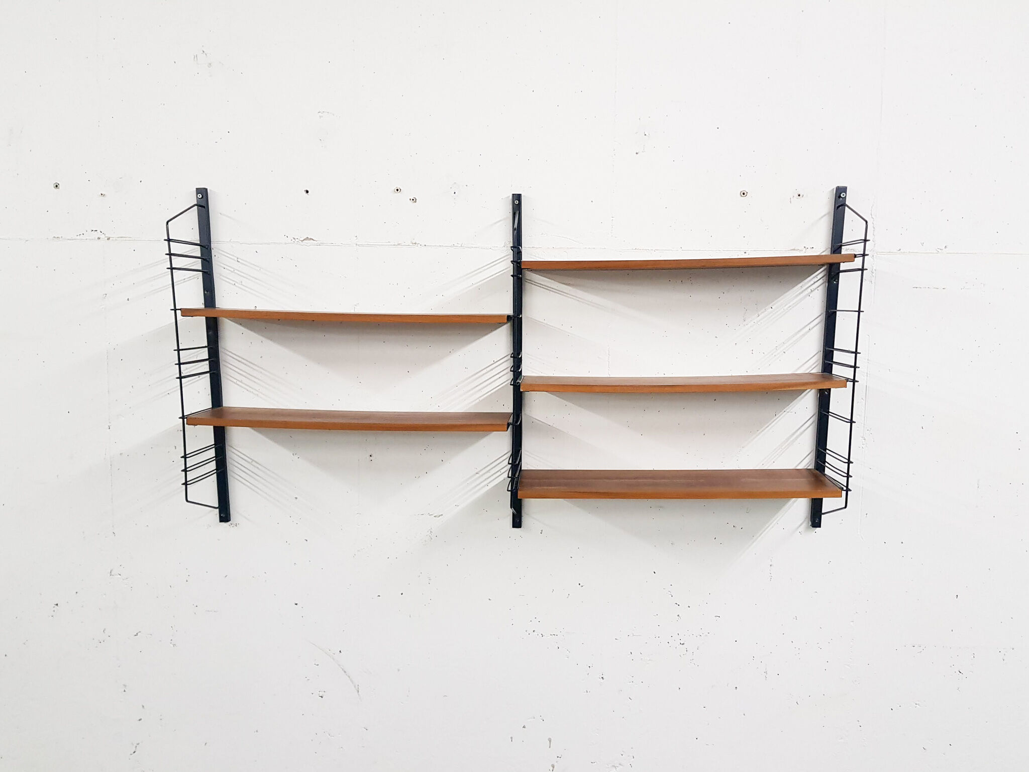 Mid-century book shelves in the style of Tomado