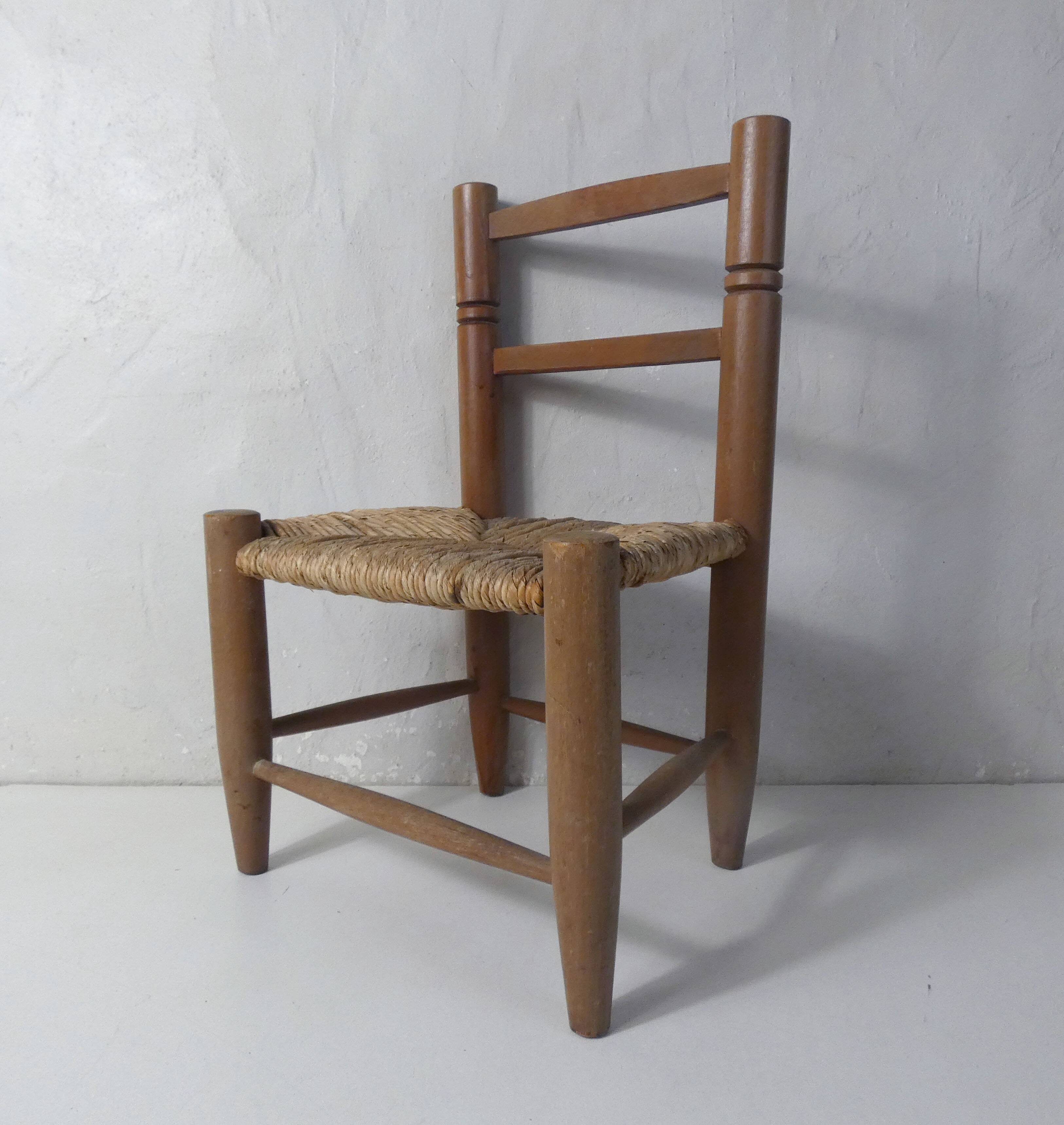 Old wooden straw chair for children