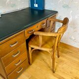 Antique curved wooden armchair in Baumann style