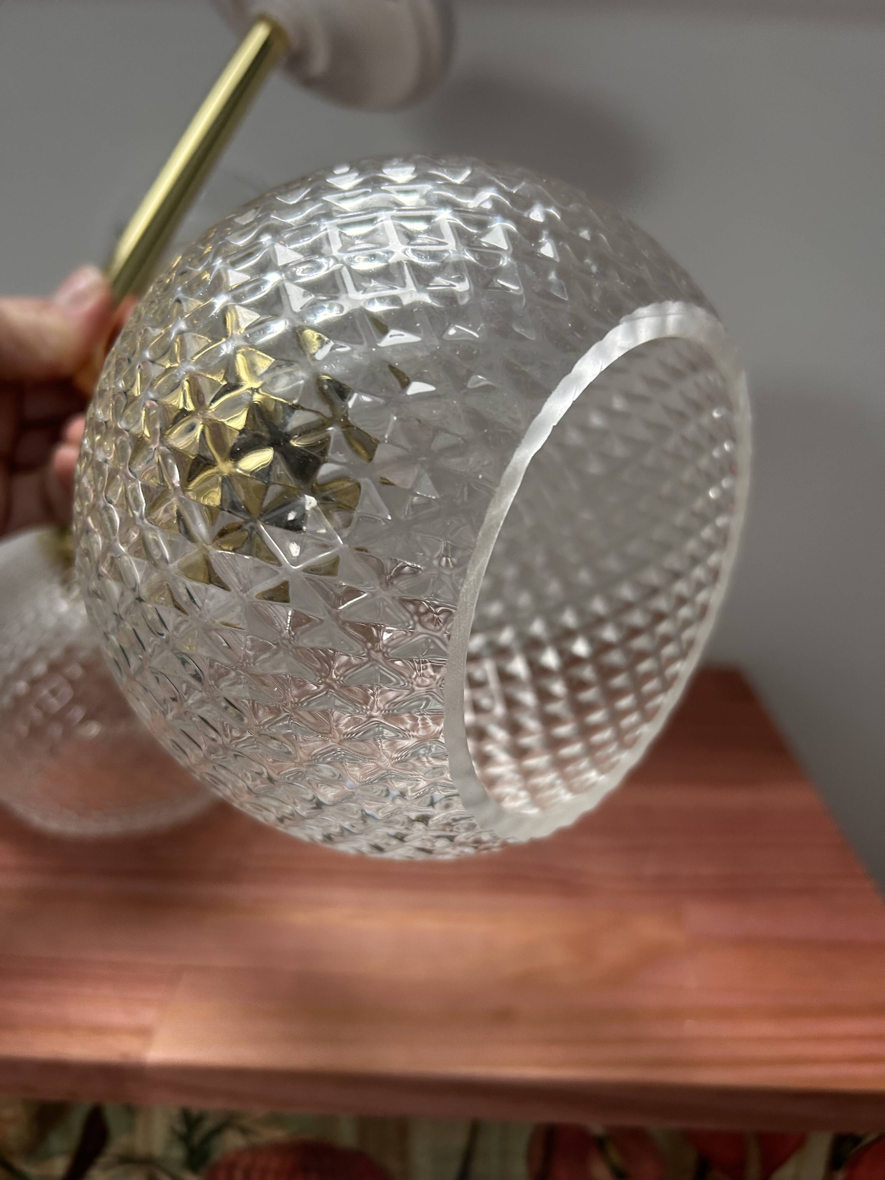 Pair of chiseled glass wall sconces