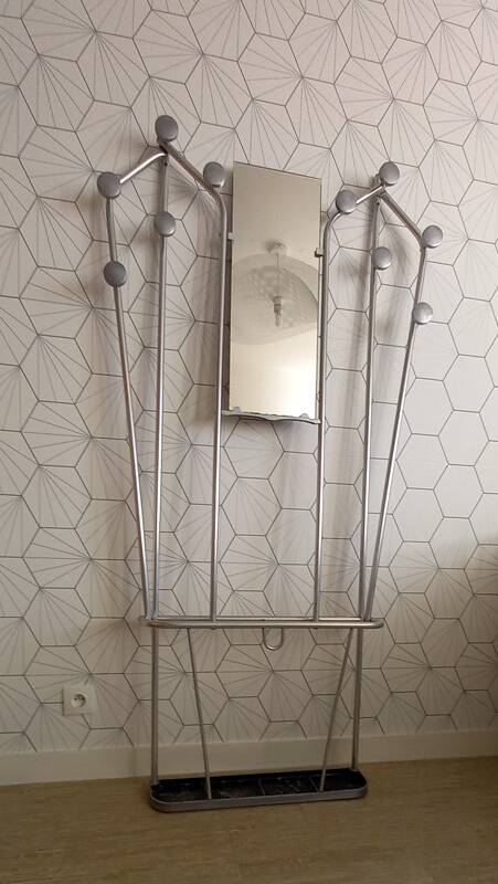 Vintage aluminum wall coat rack.