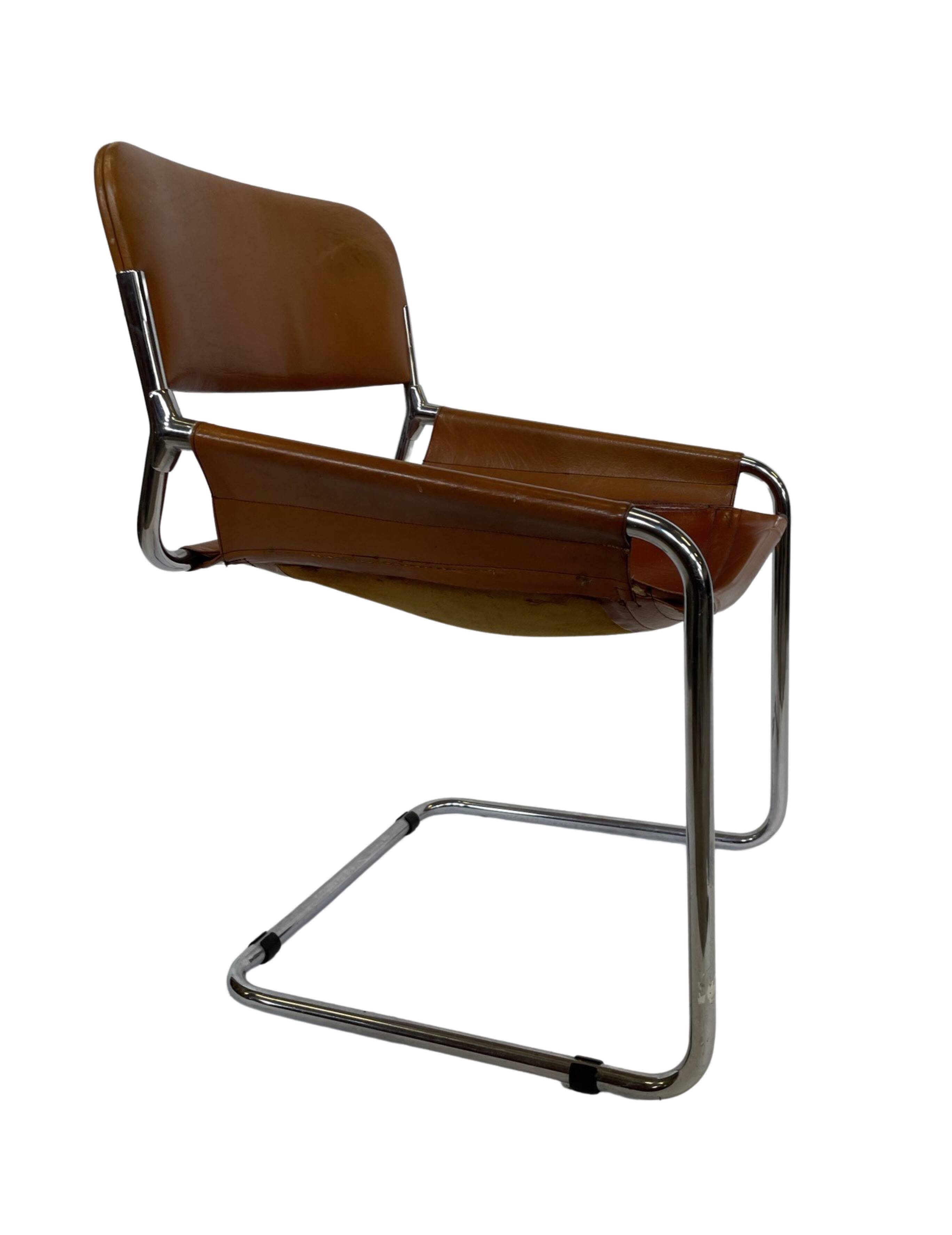 vintage dining room chair in cognac leather and chrome 1970s Italy