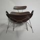Fauteuil conçu par Yuzuru Yamakawa Structure en métal. Assise et dossier en rotin tressé.
