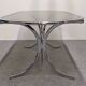 Oval dining table in chromed metal and smoked glass, Italy circa 1970