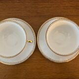 2 porcelain teacups and under teacups floral motifs