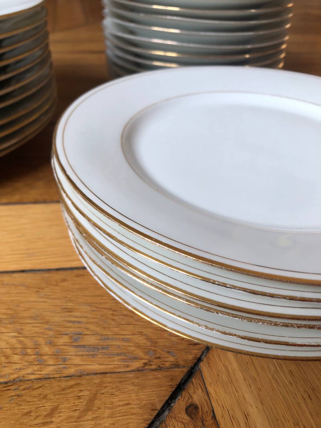 Lot of 28 porcelain plates with golden edging