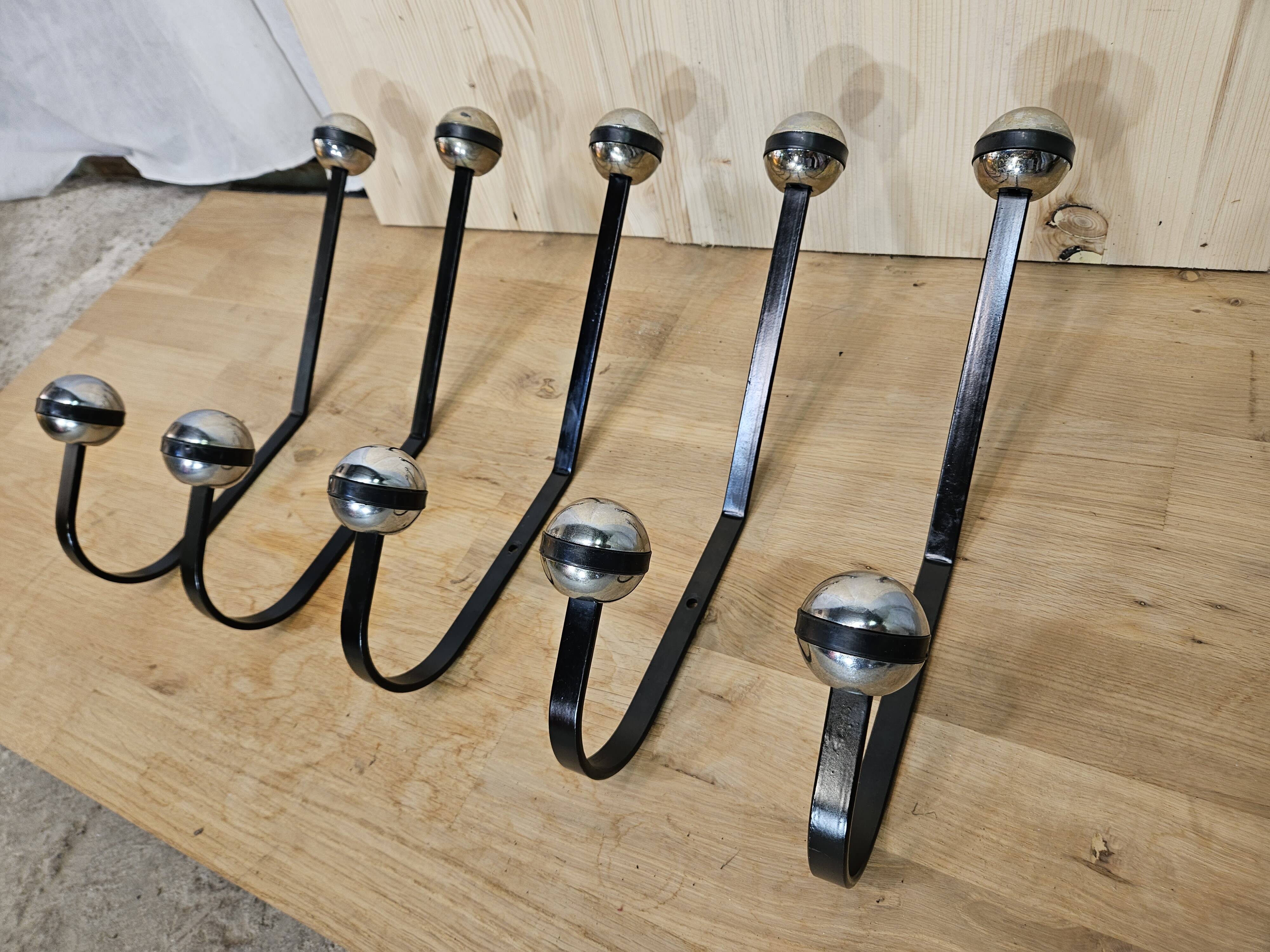 5 black and silver coat hooks from the 60s