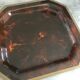 Tray in lucite imitation tortoiseshell and hexagonal brass strap