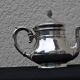 Christofle teapot with pine cone