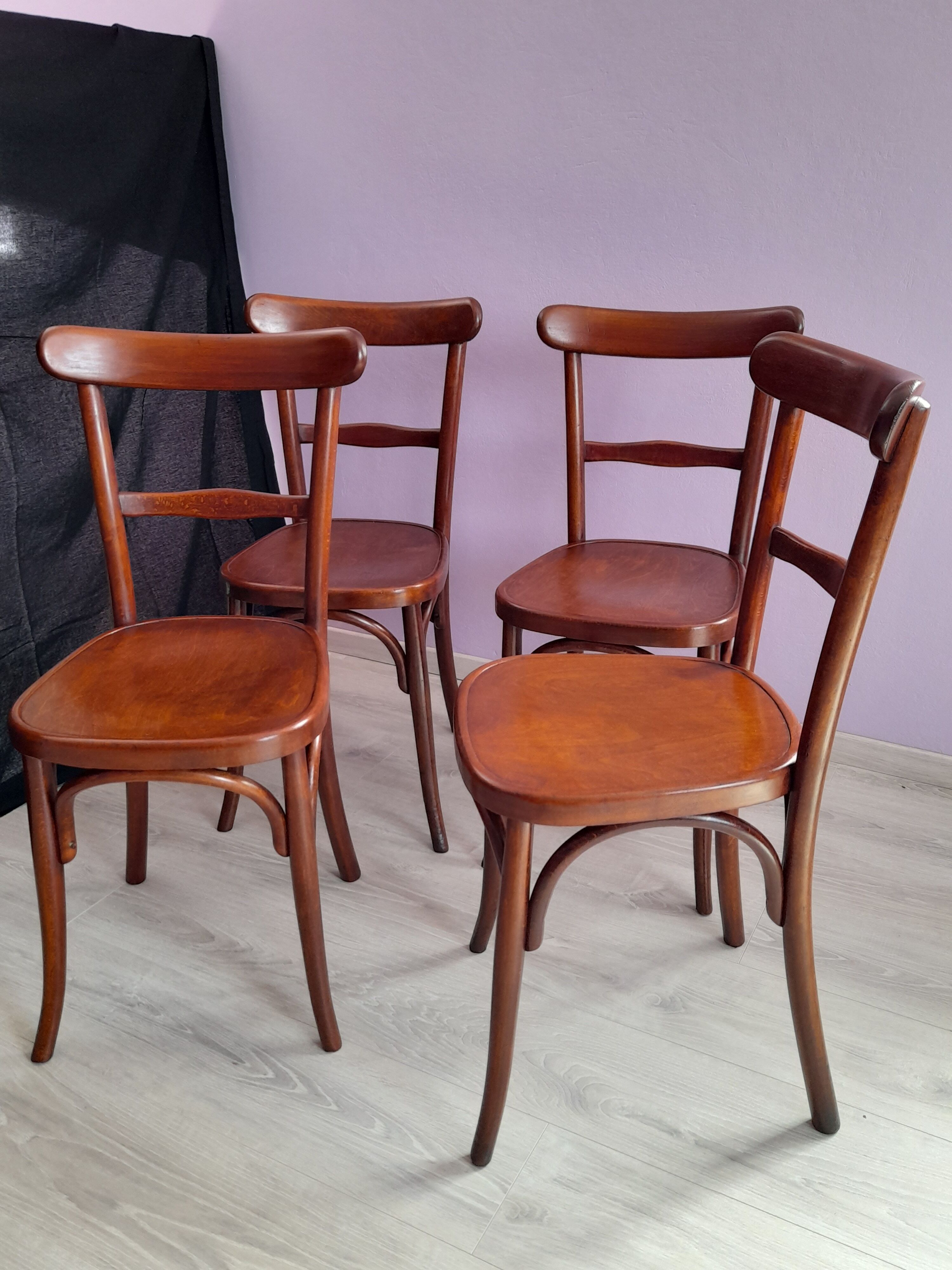 Suite of 4 bistro chairs, published by fischel