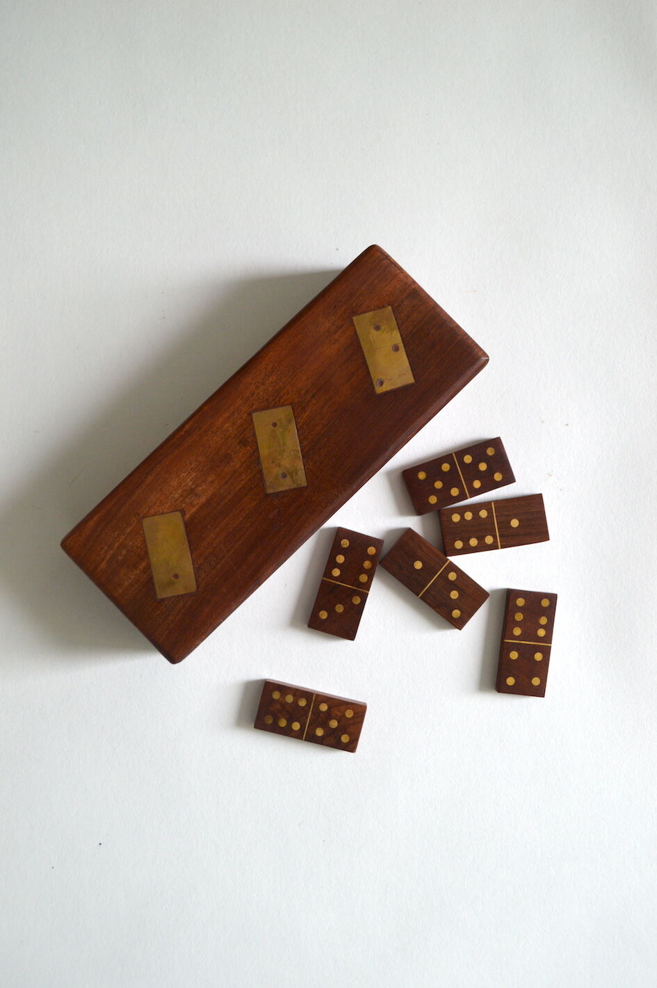 Box of brass and rosewood dominoes