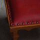 Danish sculpted oak stool from the mid-20th century with a red leather seat, 1950s.
