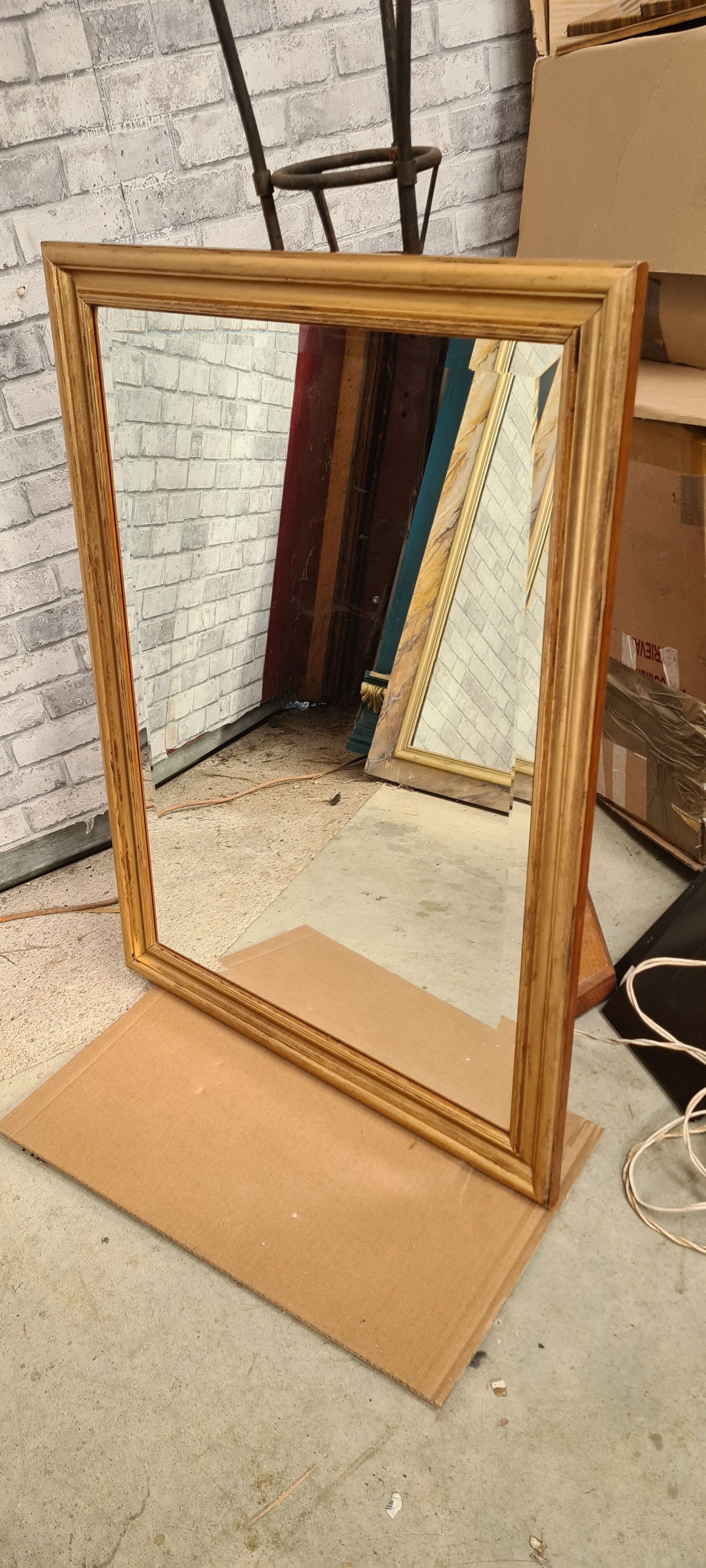 Gilded mirror on wood, 89x59