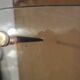 Table basse vintage "verre et laiton"