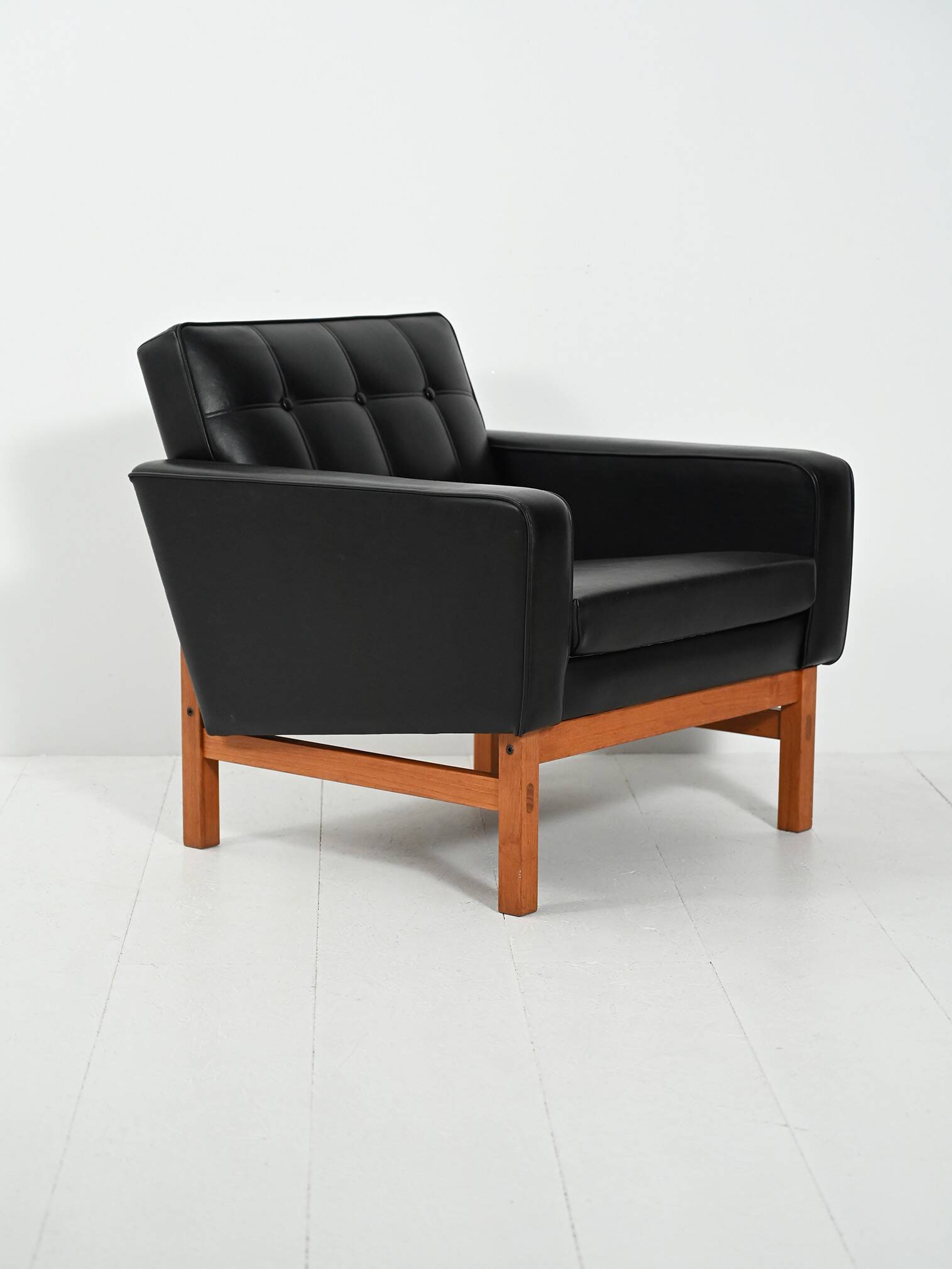 Swedish AB Futura teak and faux leather armchair