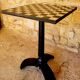 Old vintage bistro table brand Fischel in cast iron