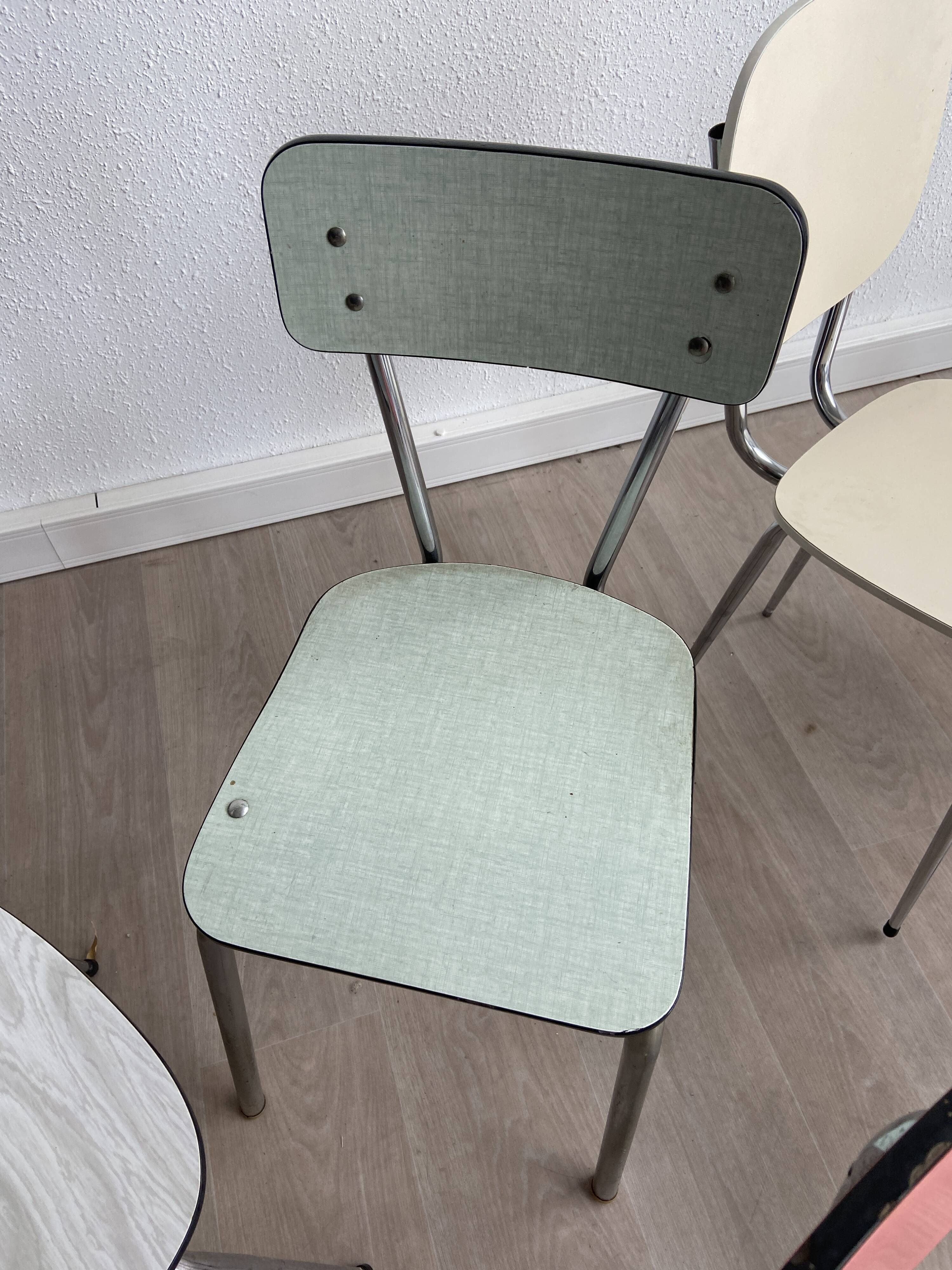 10 mismatched multicolored Formica chairs 60s