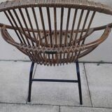 Shell-shaped armchair in rattan with metal legs. Caravane brand.