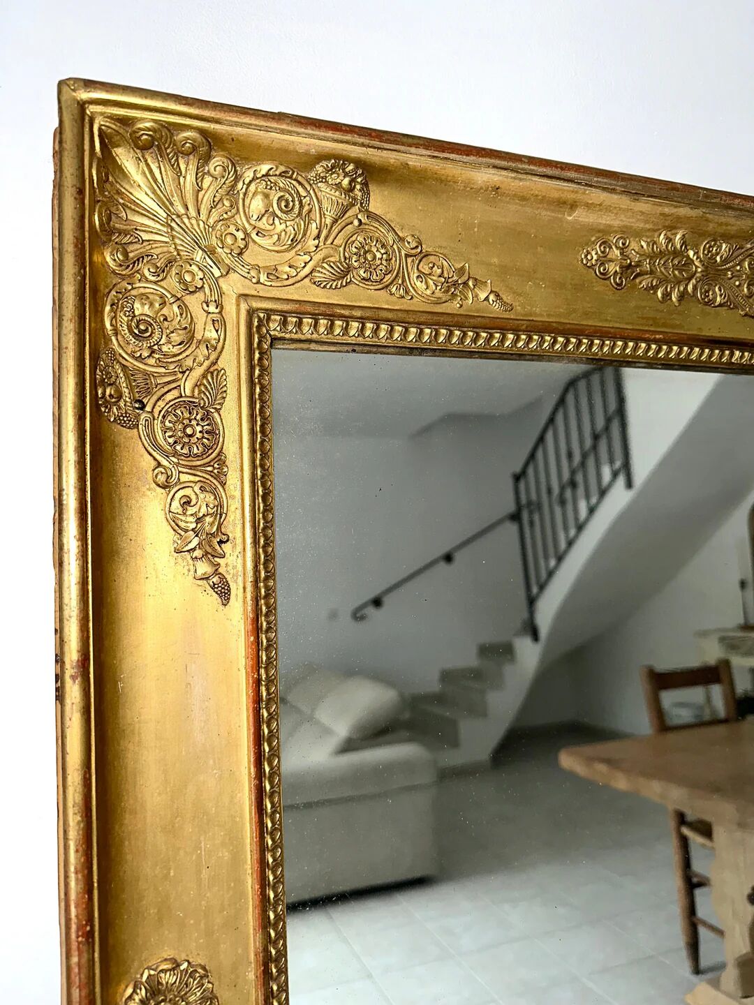 Antique gilded mirror from the Restoration period, 19th century.