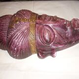 African mask in earth