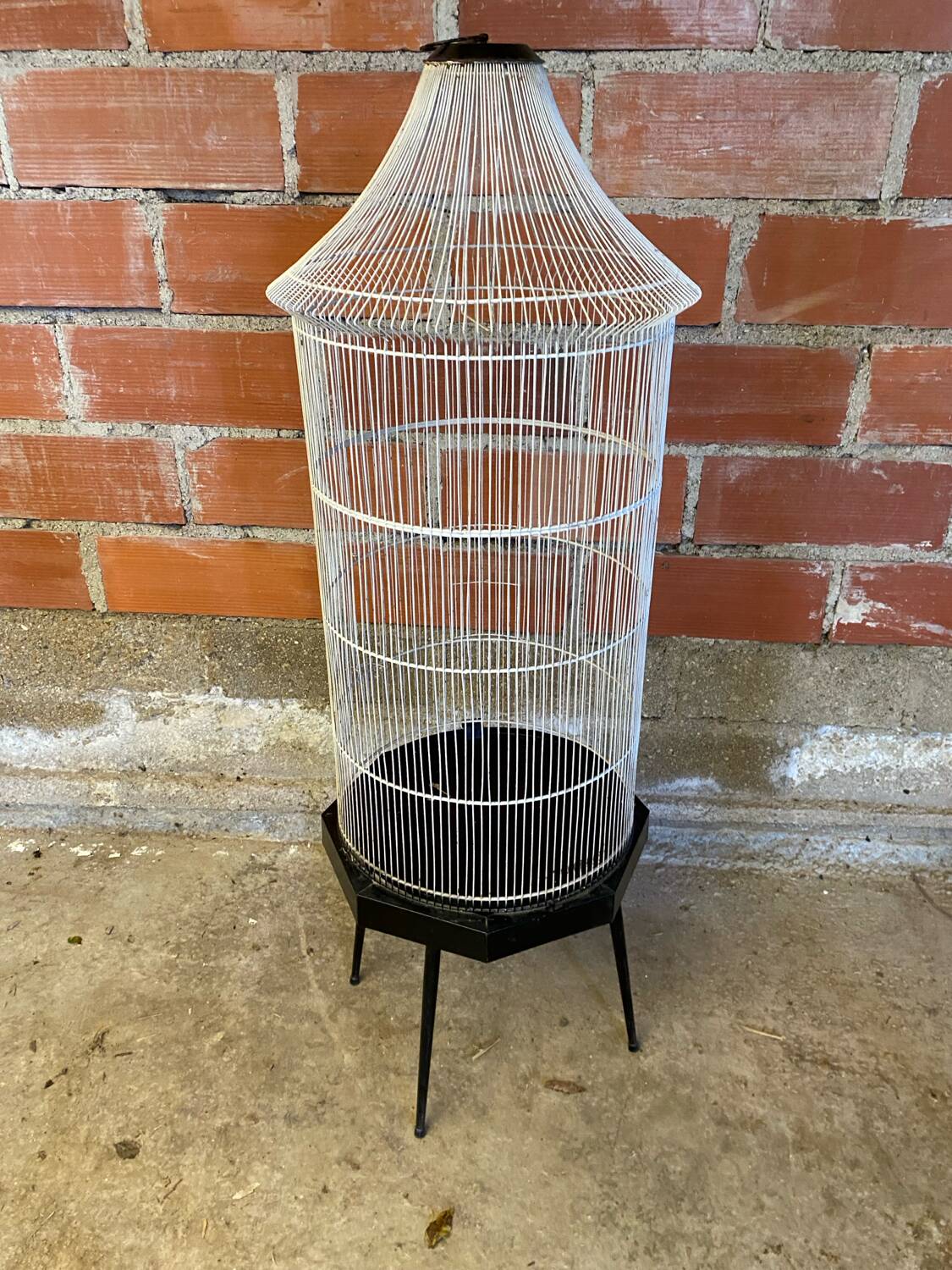 Antique black & white metal bird cage on vintage decorative legs
