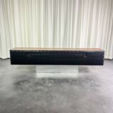 Modernist lowboard, faux leather, wood and stainless steel, 1960.