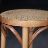 Beautiful caned stool in curved blond wood. 1940s/1950s