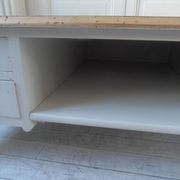 Coffee table on casters, made from an old desk, pearl gray base and belt.