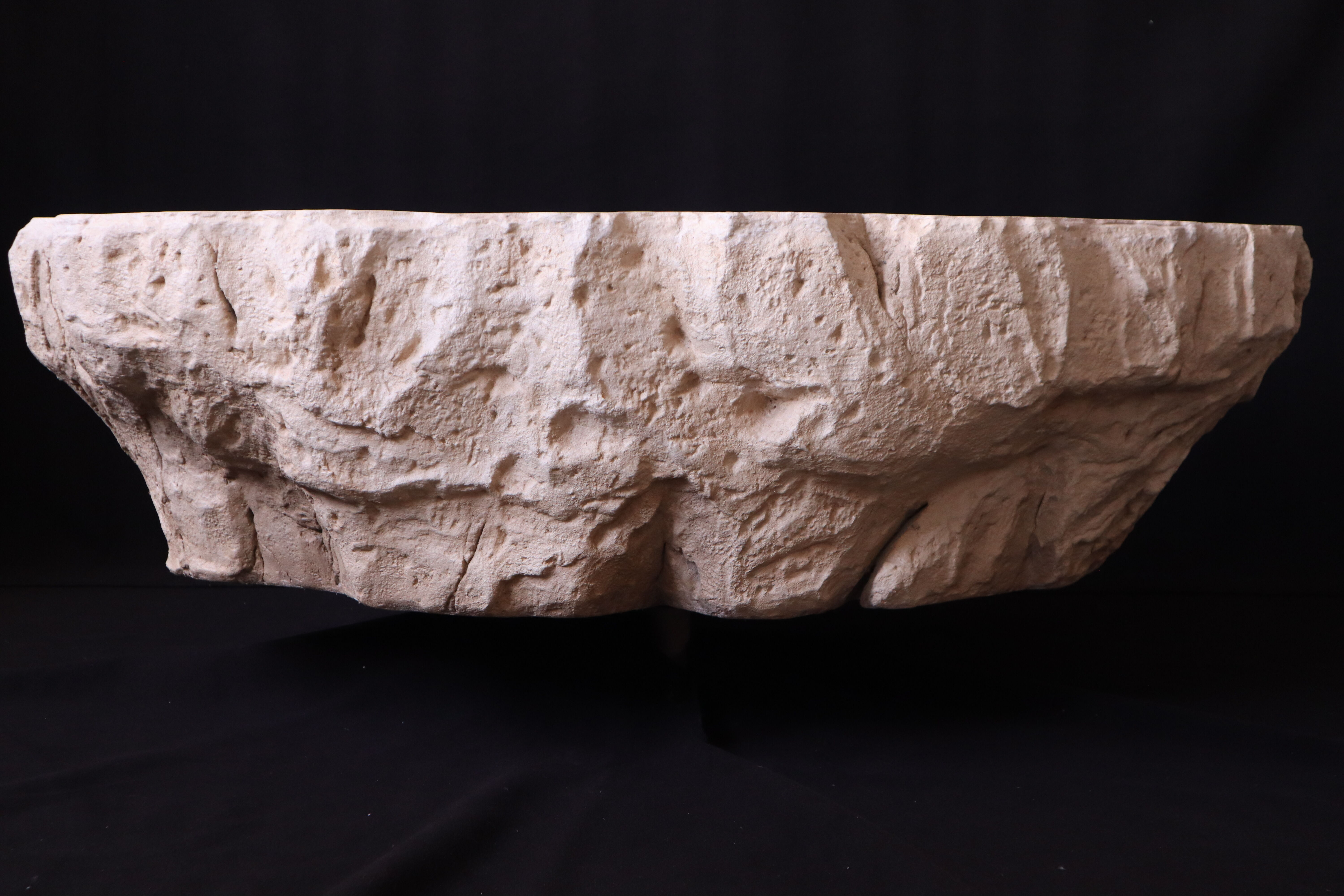 Designer coffee table with travertine rock effect — unique handcrafted piece.
