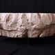 Designer coffee table with travertine rock effect — unique handcrafted piece.
