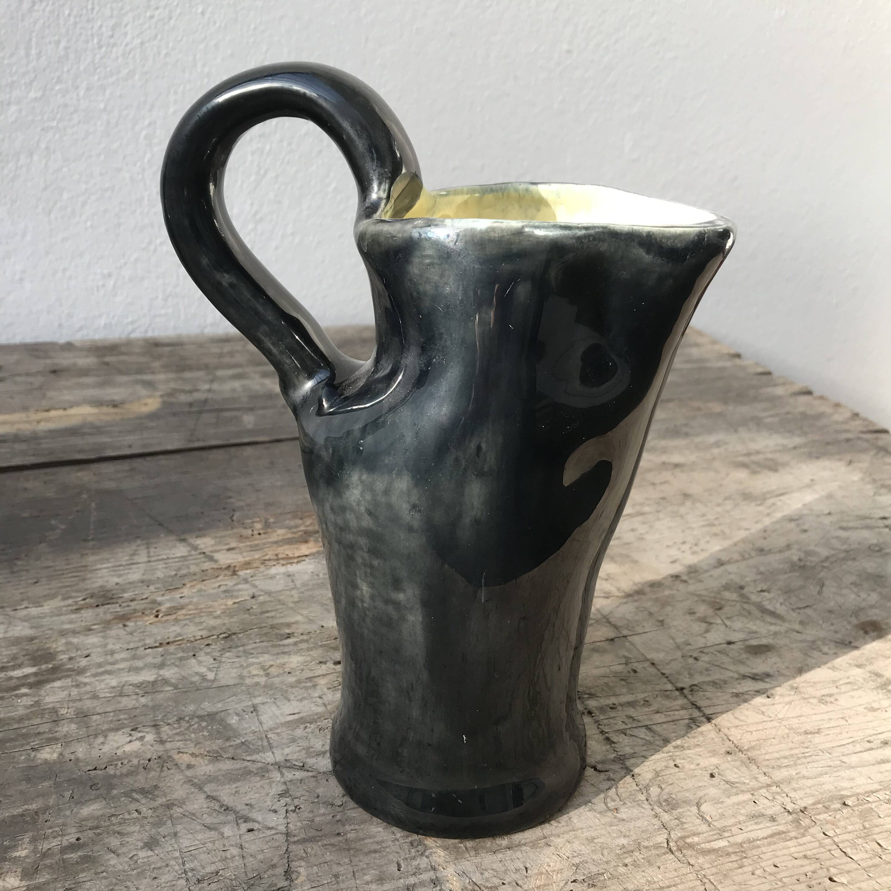 French vase, black outside yellow inside