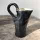 French vase, black outside yellow inside