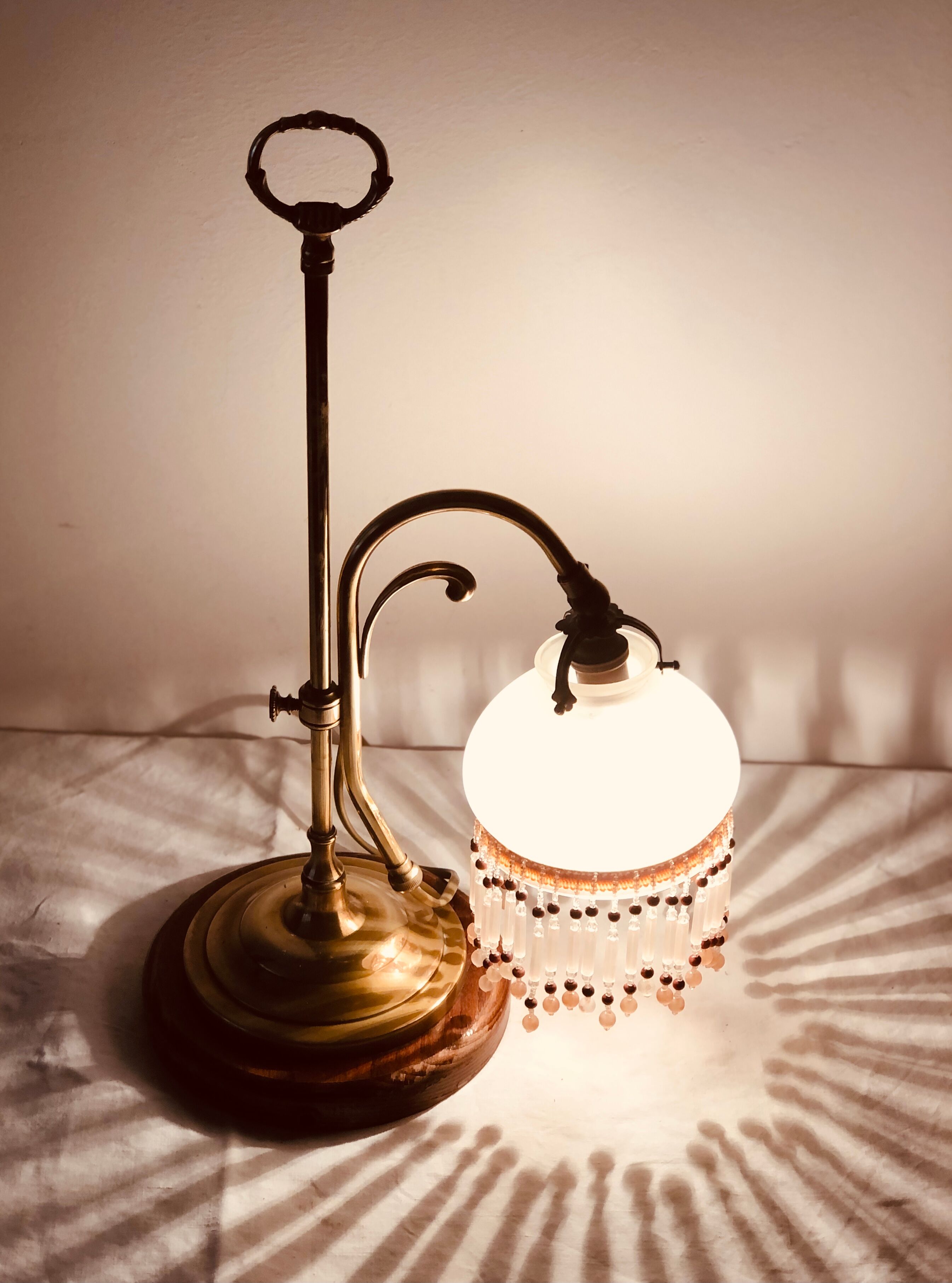 Old lamp adjustable on foot tulip golden brass.