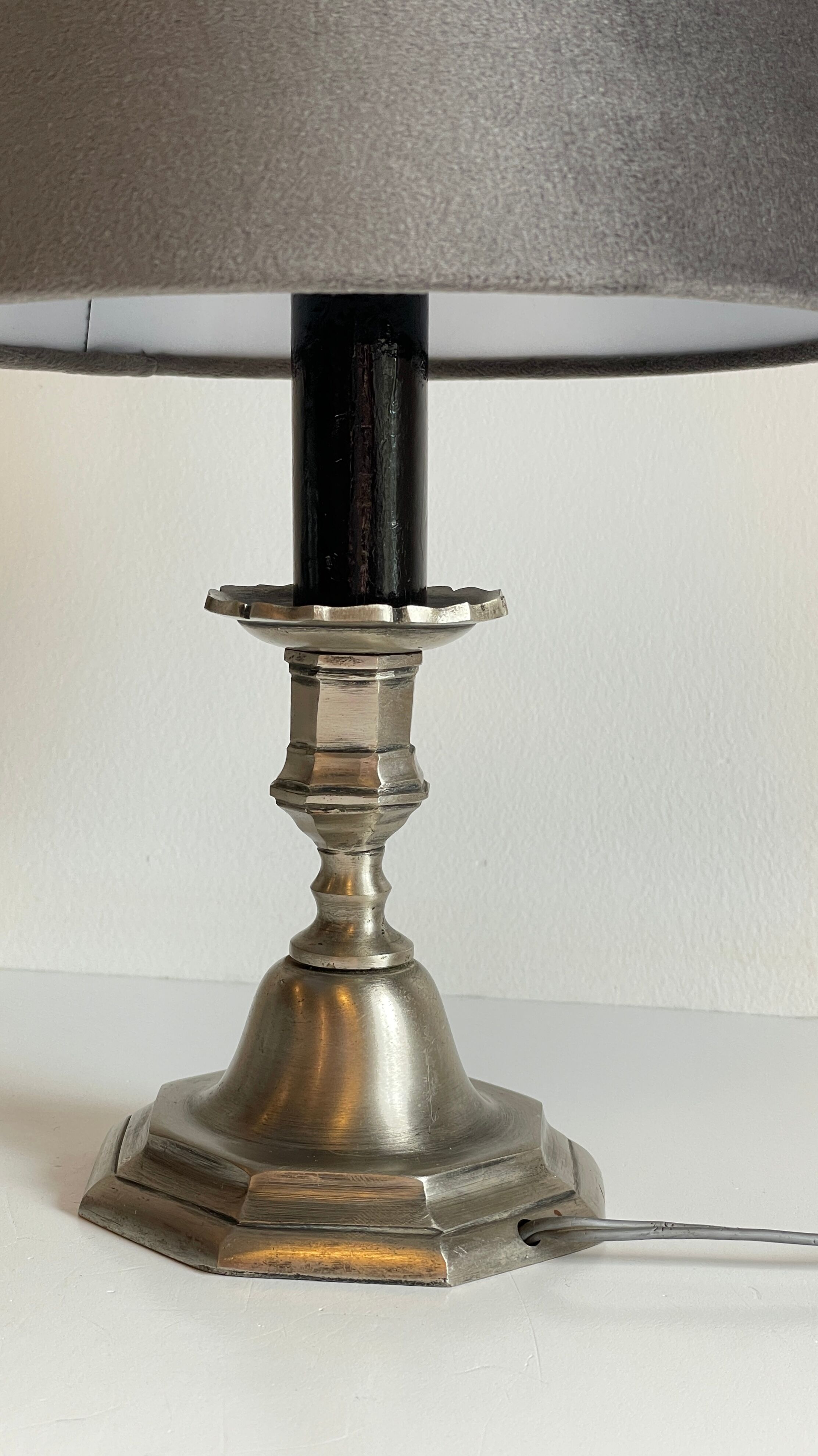 Steel candlestick lamp and grey velvet