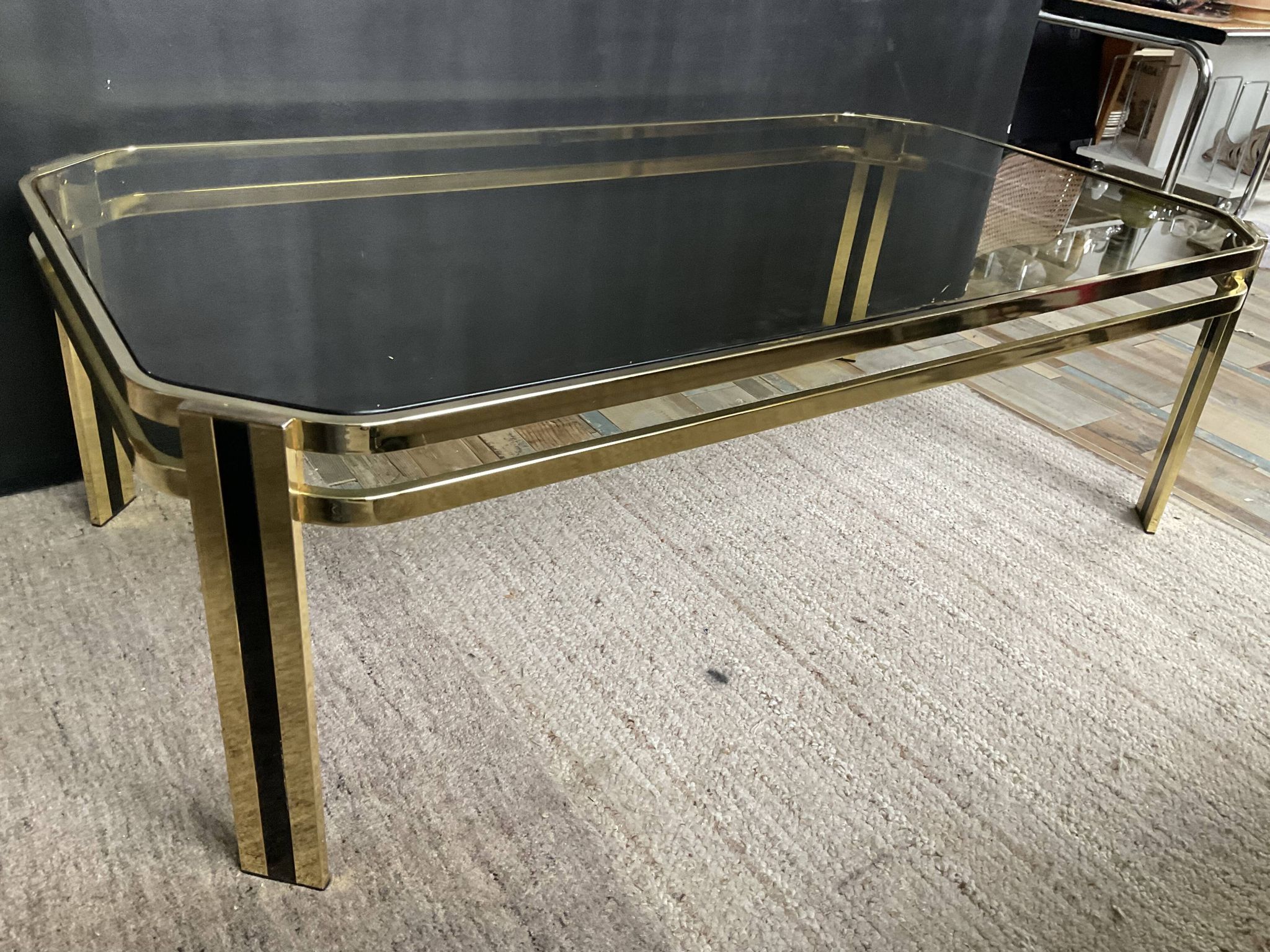 Vintage 1970s coffee table in gold metal and smoked glass.
