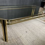 Vintage 1970s coffee table in gold metal and smoked glass.