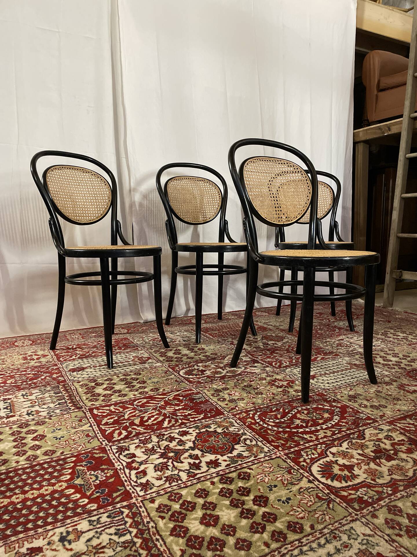 Set of 4 bentwood bistro chairs in black with caning.