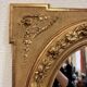 Louis XVI Style Medallion Mirror in gilded wood