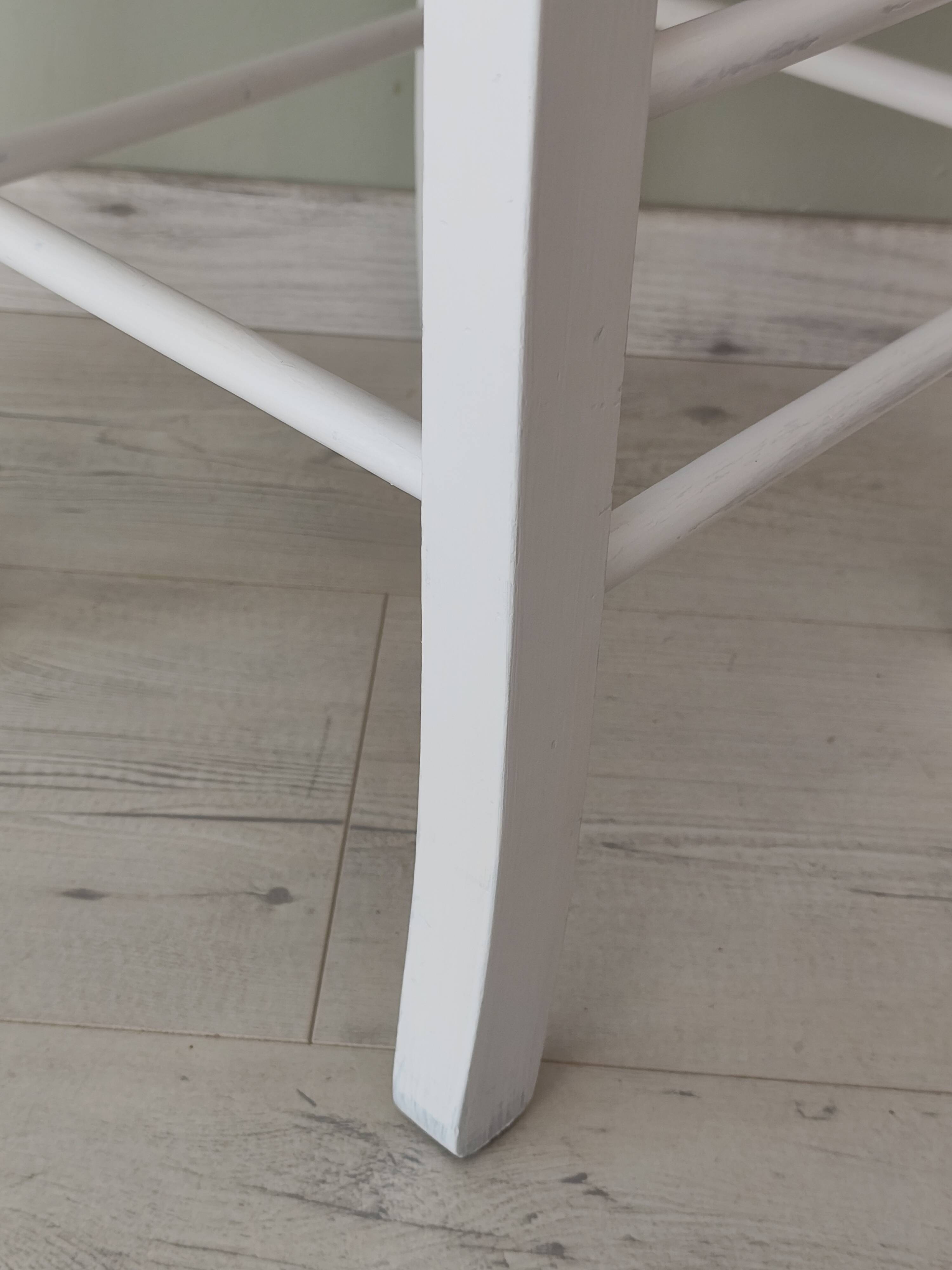 White pine stool with a red seat.