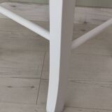 White pine stool with a red seat.