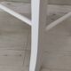 White pine stool with a red seat.