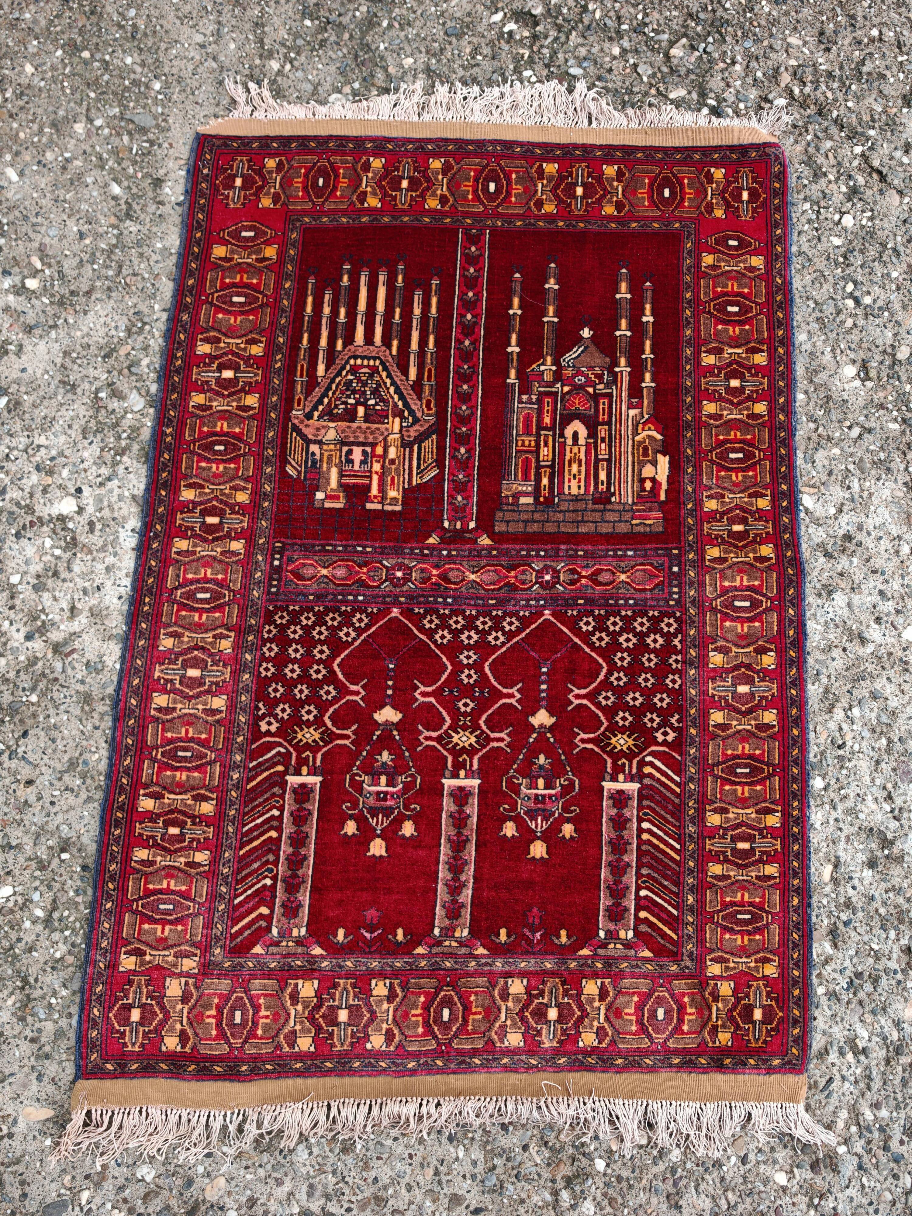 Vintage Afghan hand-knotted prayer rug with Islamic patterns.