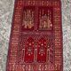 Vintage Afghan hand-knotted prayer rug with Islamic patterns.