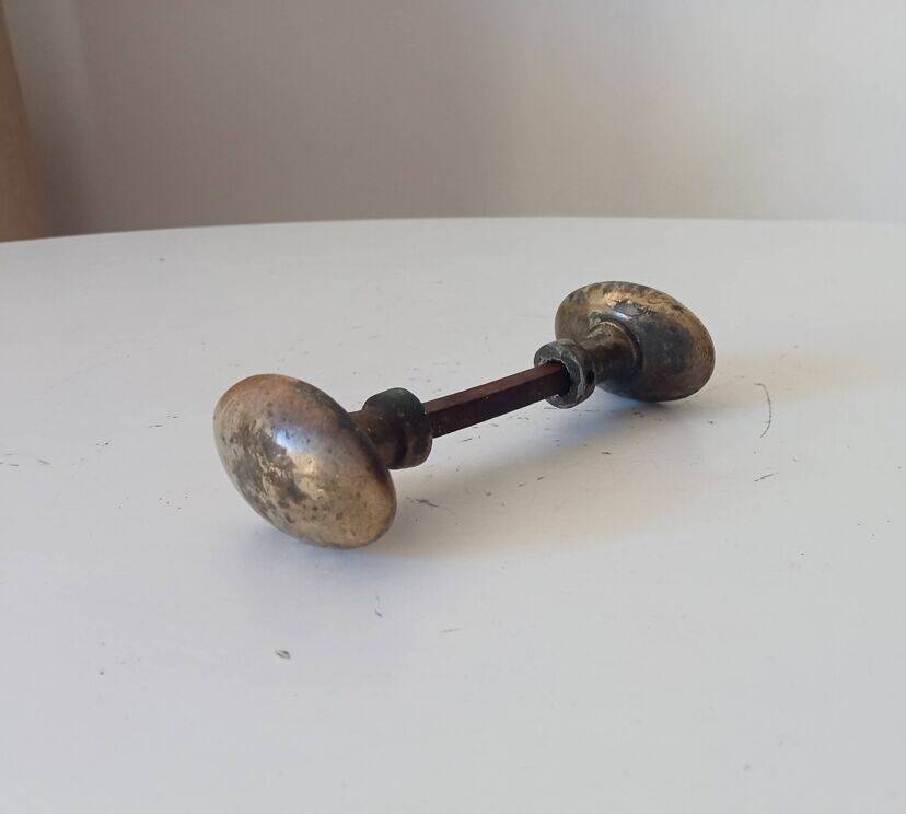 Pair of antique oval door handles in solid gold-plated brass.