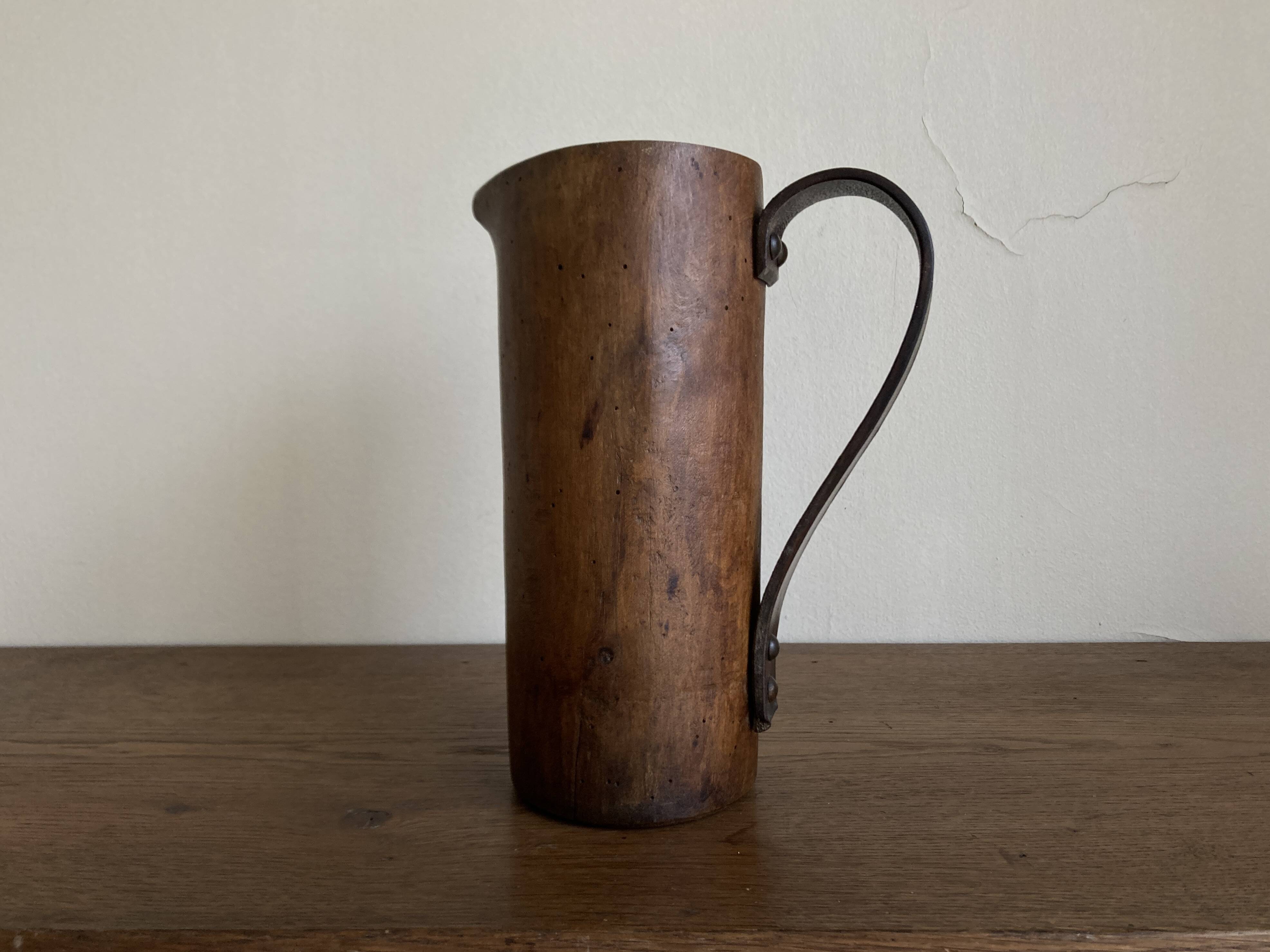 Mountain pitcher in monoxile wood and leather folk art