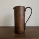 Mountain pitcher in monoxile wood and leather folk art