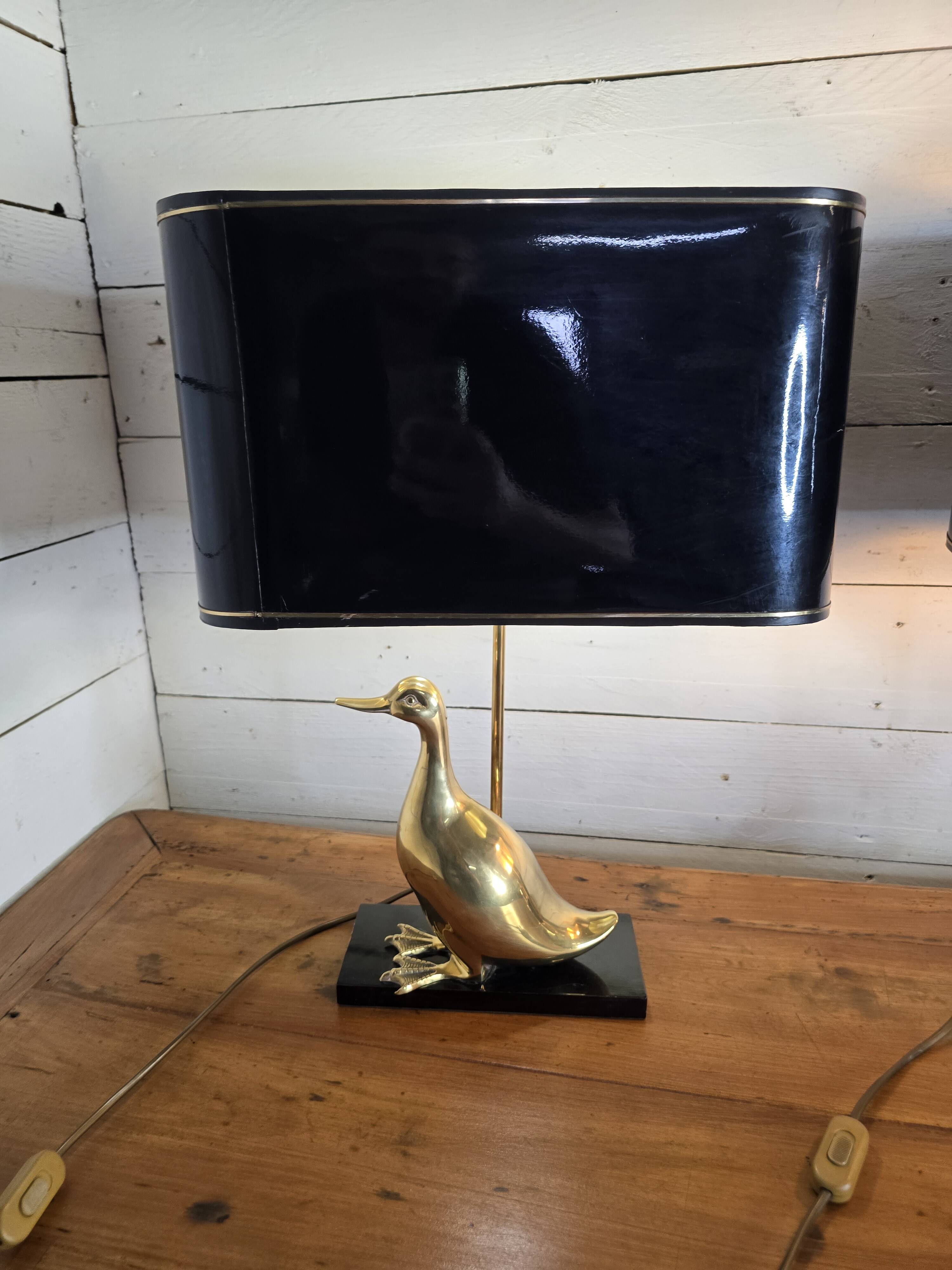 Pair of 70s table lamps featuring a brass duck